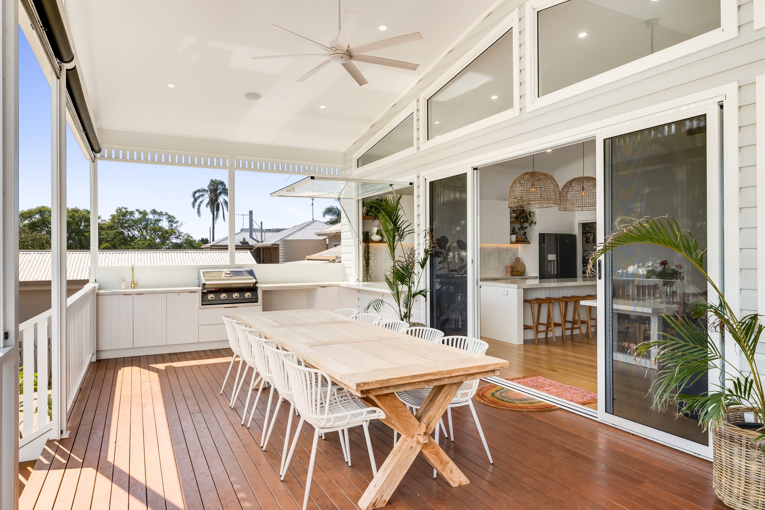 Queenslander renovation, Toowoomba — Covered deck with an outdoor kitchen, opening into the new kitchen